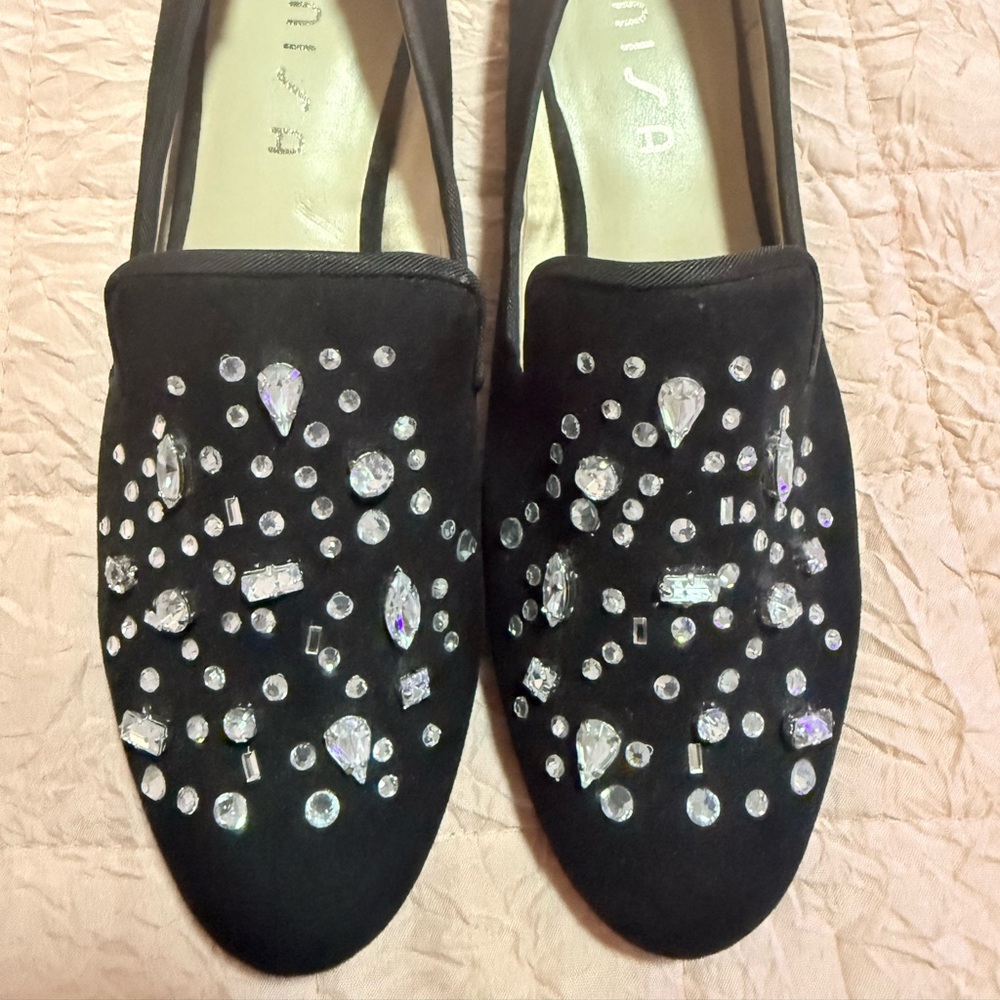 ✨ Elegant black Unisa loafers with crystal embellishments across the toe.